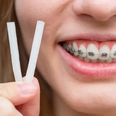 person smiling with braces
